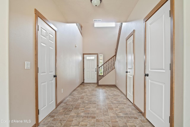 7833 N Hilliard Ct, Coeur Dalene, ID 83815 - entrance foyer with stone finish flooring and stairs