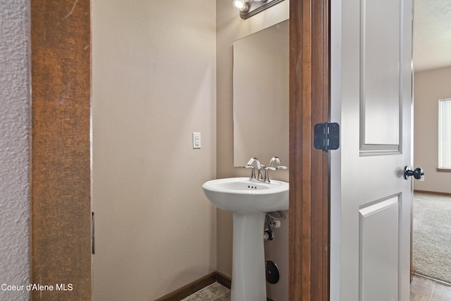 7833 N Hilliard Ct, Coeur Dalene, ID 83815 - bathroom with a sink and baseboards