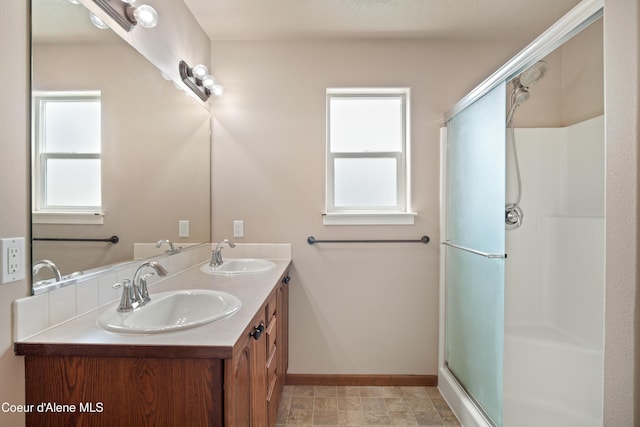 7833 N Hilliard Ct, Coeur Dalene, ID 83815 - bathroom with double vanity and an enclosed shower
