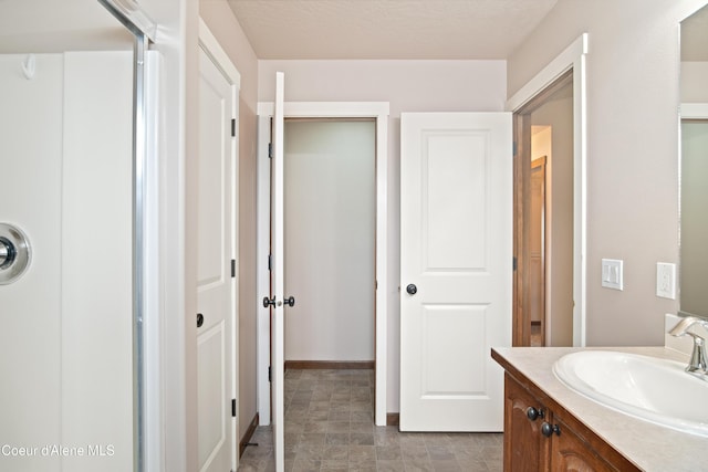 7833 N Hilliard Ct, Coeur Dalene, ID 83815 - bathroom with vanity and stone finish flooring