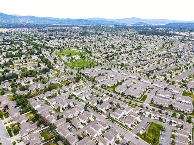 7833 N Hilliard Ct, Coeur Dalene, ID 83815 - aerial overview of property's location with a mountain backdrop