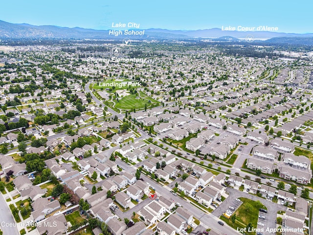 7833 N Hilliard Ct, Coeur Dalene, ID 83815 - aerial overview of property's location with a mountainous background