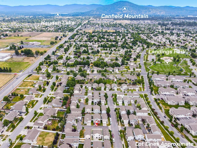 7833 N Hilliard Ct, Coeur Dalene, ID 83815 - view of property location with a mountain backdrop and nearby suburban area