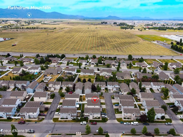 7833 N Hilliard Ct, Coeur Dalene, ID 83815 - aerial view of property and surrounding area with a mountain backdrop