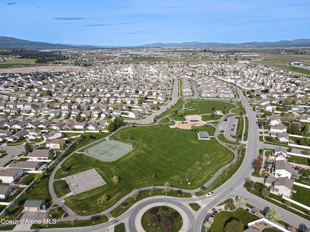 7833 N Hilliard Ct, Coeur Dalene, ID 83815 - aerial view of property's location featuring mountains and nearby suburban area