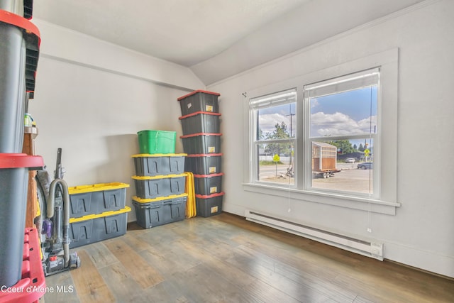 32271 N 5th Ave, Spirit Lake, ID 83869 - spare room with baseboard heating, vaulted ceiling, and wood finished floors