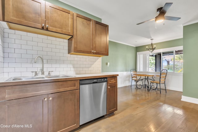 32271 N 5th Ave, Spirit Lake, ID 83869 - kitchen with dishwasher, crown molding, light wood finished floors, decorative backsplash, and a chandelier