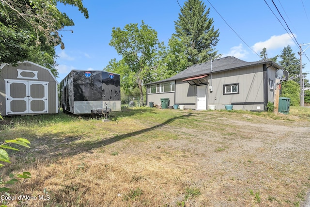 32271 N 5th Ave, Spirit Lake, ID 83869 - rear view of house featuring a storage unit, a yard, and crawl space