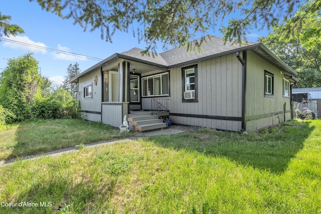 32271 N 5th Ave, Spirit Lake, ID 83869 - view of front of home featuring a front lawn, roof with shingles, and cooling unit
