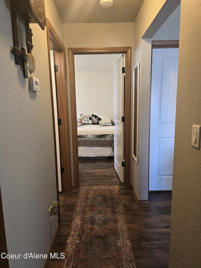 7812 W Kayak Ct, Rathdrum, ID 83858 - hall with dark wood-style floors and a textured wall