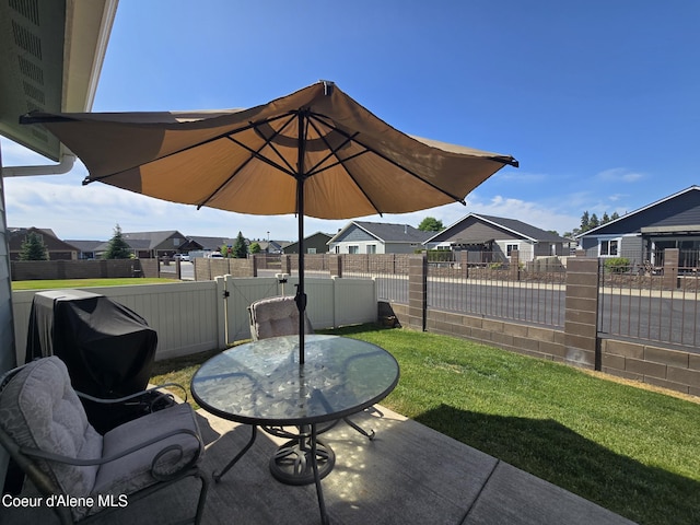 7812 W Kayak Ct, Rathdrum, ID 83858 - fenced backyard featuring a residential view, a patio area, and a gate