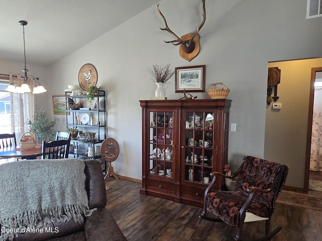 7812 W Kayak Ct, Rathdrum, ID 83858 - dining room featuring wood finished floors, a chandelier, and lofted ceiling