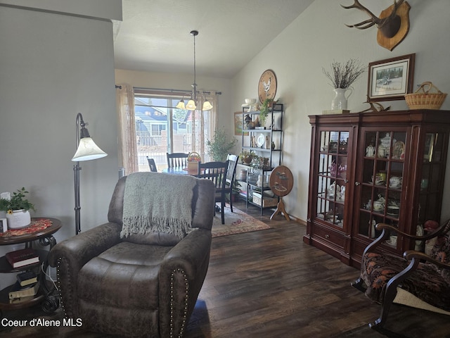 7812 W Kayak Ct, Rathdrum, ID 83858 - living area with dark wood-style floors, a chandelier, and lofted ceiling