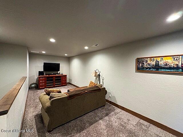 1402 W Wayward Cir, Post Falls, ID 83854 - carpeted living area with baseboards and recessed lighting