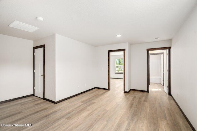 8 Potlatch Loop, Priest River, ID 83856 - empty room featuring light wood-style flooring, a smoke detector, and recessed lighting