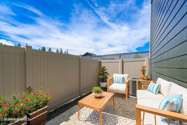 8 Potlatch Loop, Priest River, ID 83856 - fenced backyard featuring a patio and an outdoor living space