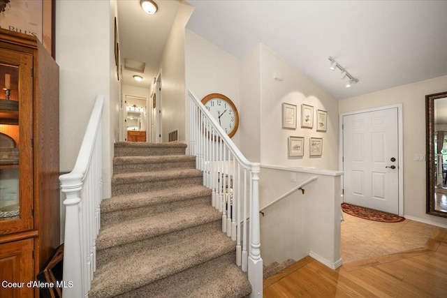 2372 E Thomas Hill Dr, Coeur Dalene, ID 83815 - entryway with light wood-style floors, track lighting, and stairway