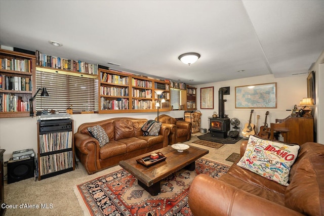 2372 E Thomas Hill Dr, Coeur Dalene, ID 83815 - living area with a wood stove and carpet