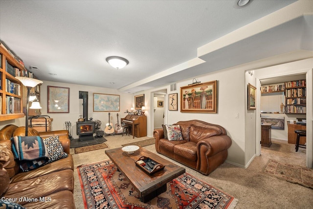 2372 E Thomas Hill Dr, Coeur Dalene, ID 83815 - carpeted living room featuring a wood stove