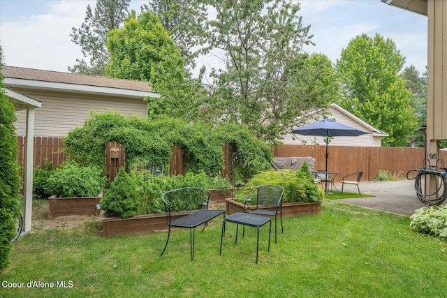 2372 E Thomas Hill Dr, Coeur Dalene, ID 83815 - view of yard featuring a vegetable garden and a patio