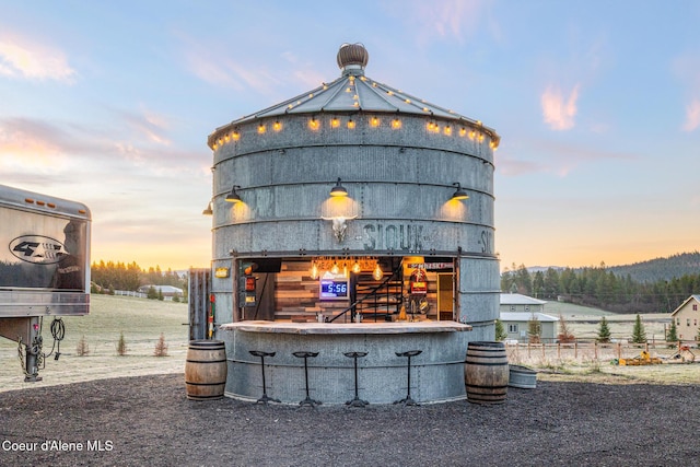 5841 W Clemetson Rd, Coeur Dalene, ID 83814 - outdoor structure at dusk featuring a barn