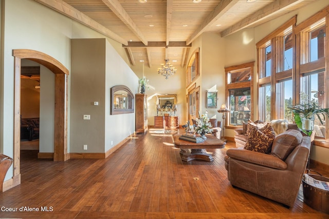 5841 W Clemetson Rd, Coeur Dalene, ID 83814 - living room with a wood ceiling with exposed beams, arched walkways, recessed lighting, hardwood / wood-style floors, and a high ceiling