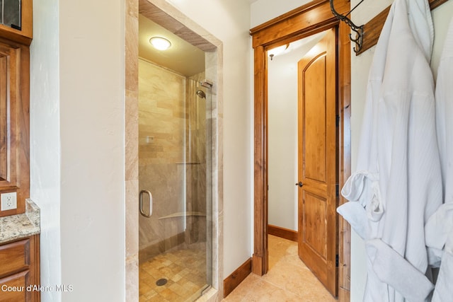 5841 W Clemetson Rd, Coeur Dalene, ID 83814 - bathroom with a stall shower, vanity, and tile patterned floors