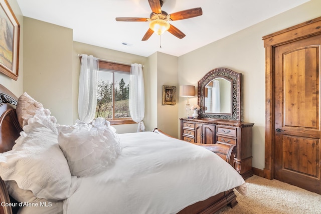 5841 W Clemetson Rd, Coeur Dalene, ID 83814 - bedroom with light carpet and ceiling fan