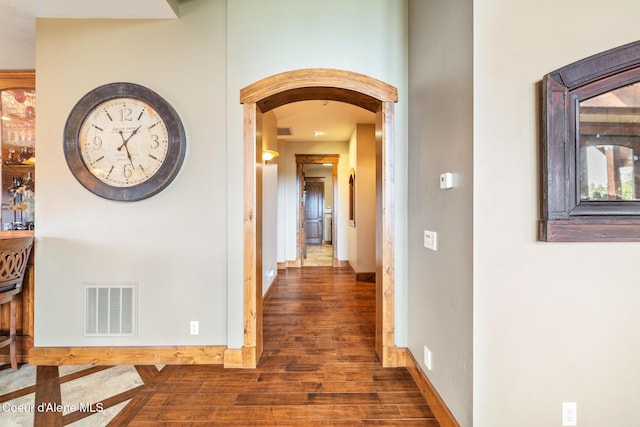 5841 W Clemetson Rd, Coeur Dalene, ID 83814 - corridor featuring arched walkways and wood finished floors