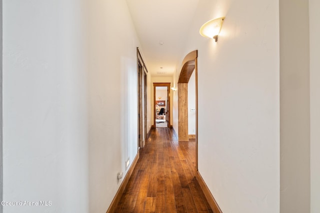 5841 W Clemetson Rd, Coeur Dalene, ID 83814 - hall featuring dark wood-style floors and arched walkways