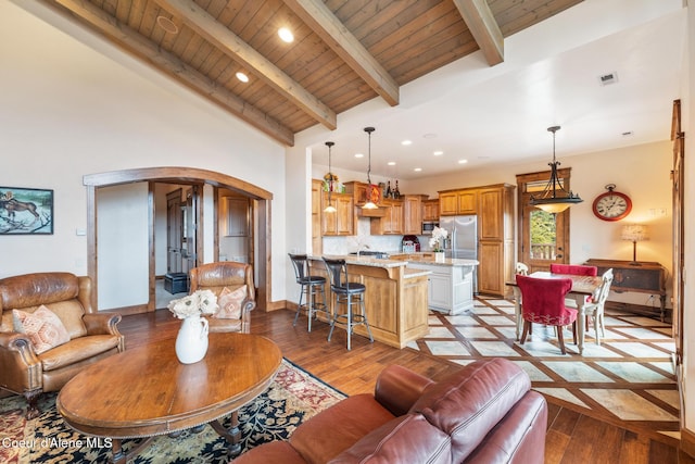 5841 W Clemetson Rd, Coeur Dalene, ID 83814 - living room with arched walkways, a wood ceiling with exposed beams, light wood-style floors, recessed lighting, and high vaulted ceiling