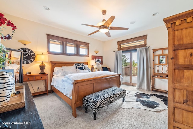5841 W Clemetson Rd, Coeur Dalene, ID 83814 - bedroom featuring access to exterior, light carpet, multiple windows, and ceiling fan
