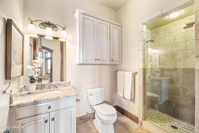 5841 W Clemetson Rd, Coeur Dalene, ID 83814 - bathroom with a shower stall, vanity, and tile patterned floors