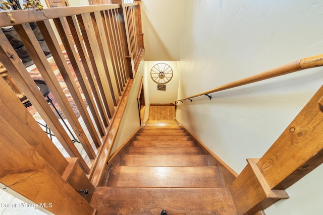5841 W Clemetson Rd, Coeur Dalene, ID 83814 - stairway featuring baseboards and wood finished floors