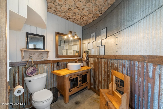 5841 W Clemetson Rd, Coeur Dalene, ID 83814 - bathroom featuring vanity and wood walls