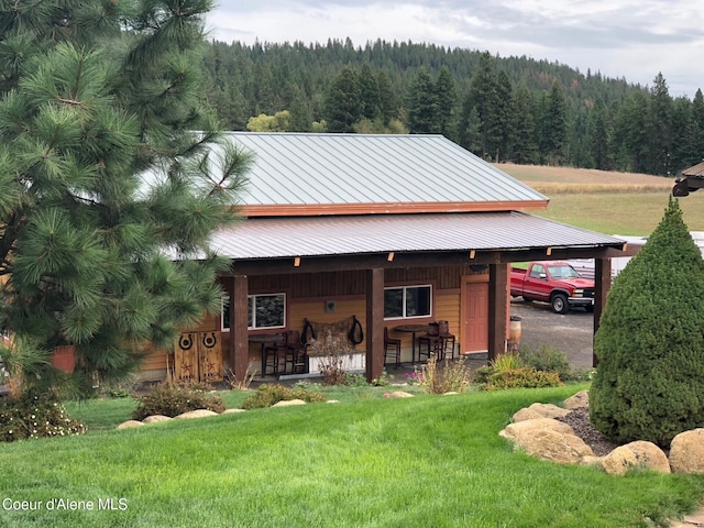 5841 W Clemetson Rd, Coeur Dalene, ID 83814 - view of outbuilding with a forest view