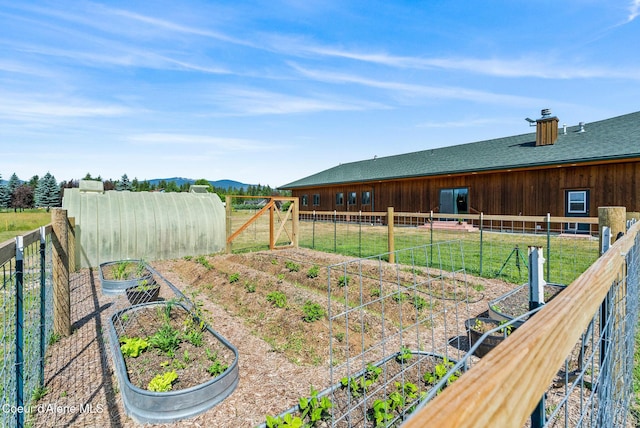 64 Heights Loop, Bonners Ferry, ID 83805 - view of yard featuring a vegetable garden and a mountain view