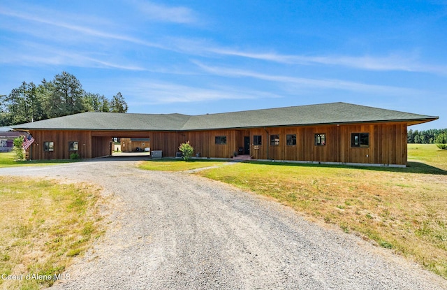 64 Heights Loop, Bonners Ferry, ID 83805 - ranch-style house featuring driveway and a front lawn