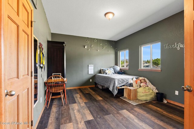64 Heights Loop, Bonners Ferry, ID 83805 - bedroom featuring dark wood-style flooring and baseboards