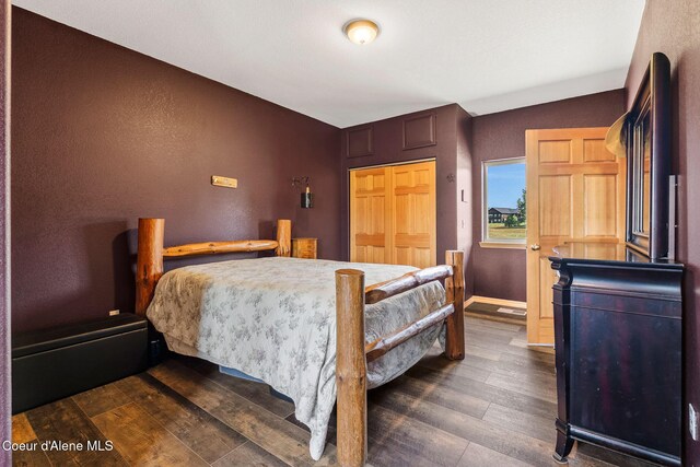 64 Heights Loop, Bonners Ferry, ID 83805 - bedroom featuring dark wood-type flooring and baseboards