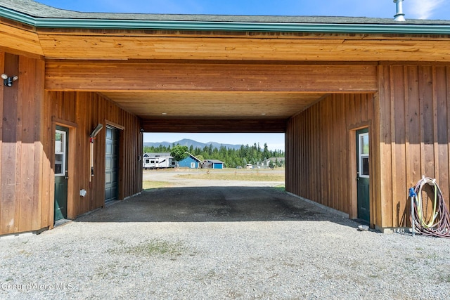 64 Heights Loop, Bonners Ferry, ID 83805 - garage with a mountain view and a carport