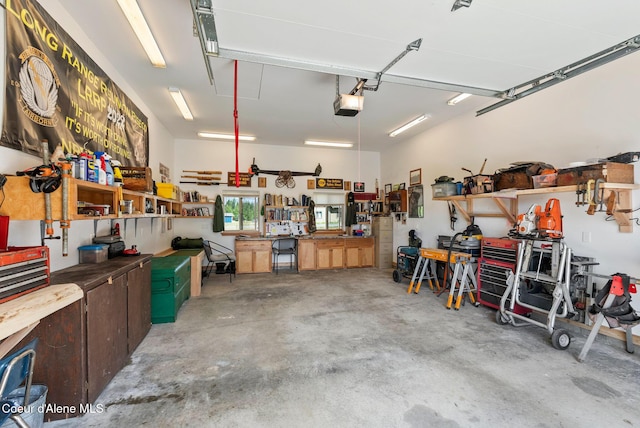 64 Heights Loop, Bonners Ferry, ID 83805 - garage featuring a workshop area and a garage door opener