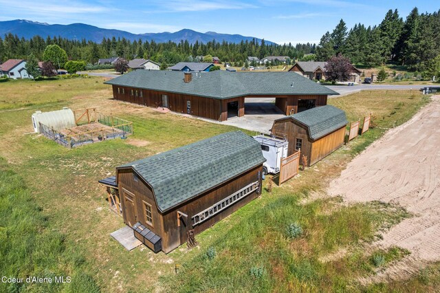 64 Heights Loop, Bonners Ferry, ID 83805 - aerial view of property and surrounding area featuring a mountain backdrop