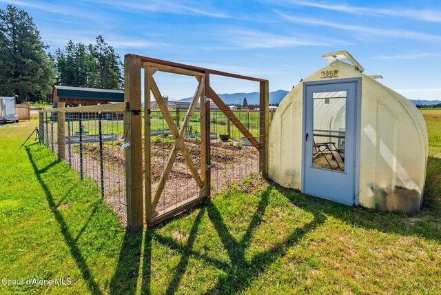 64 Heights Loop, Bonners Ferry, ID 83805 - view of outdoor structure featuring a mountain view and a garden