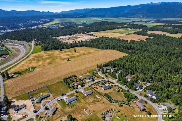 64 Heights Loop, Bonners Ferry, ID 83805 - aerial view of property's location with a mountain backdrop and property parcel outlined