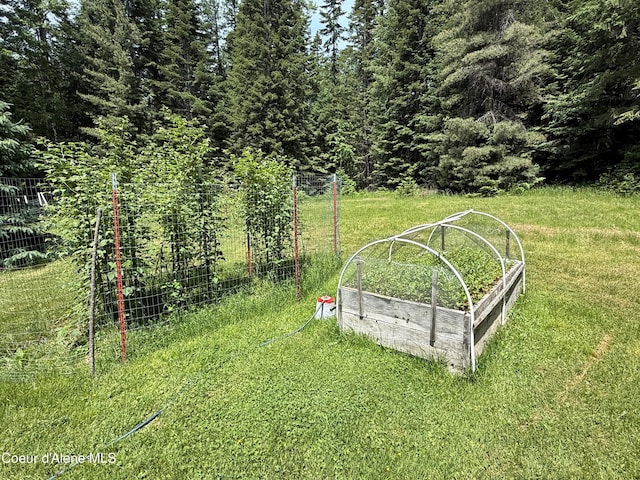 1283 N Wrenco Rd, Sandpoint, ID 83864 - view of grassy yard featuring a vegetable garden