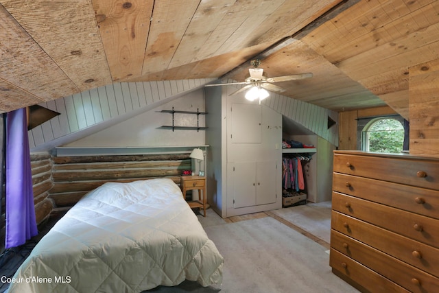 1283 N Wrenco Rd, Sandpoint, ID 83864 - carpeted bedroom with wooden ceiling, lofted ceiling, log walls, wood walls, and a closet