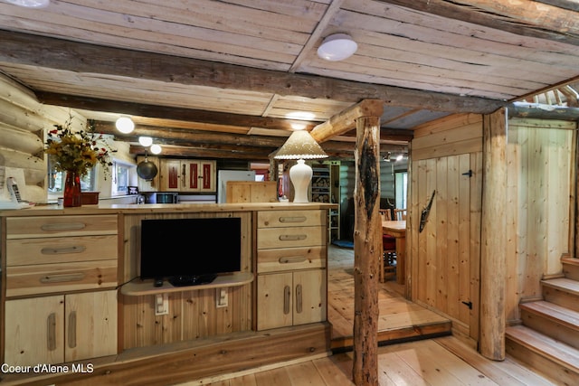 1283 N Wrenco Rd, Sandpoint, ID 83864 - basement with wood ceiling, light wood finished floors, refrigerator, and stairs