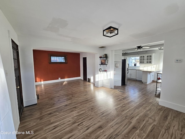 312 Park St, Mullan, ID 83846 - unfurnished living room with dark wood-type flooring and ceiling fan