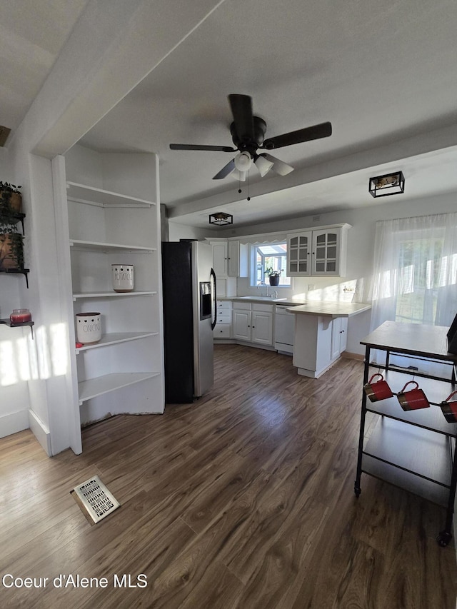 312 Park St, Mullan, ID 83846 - kitchen with stainless steel fridge, a peninsula, glass insert cabinets, white cabinets, and white dishwasher